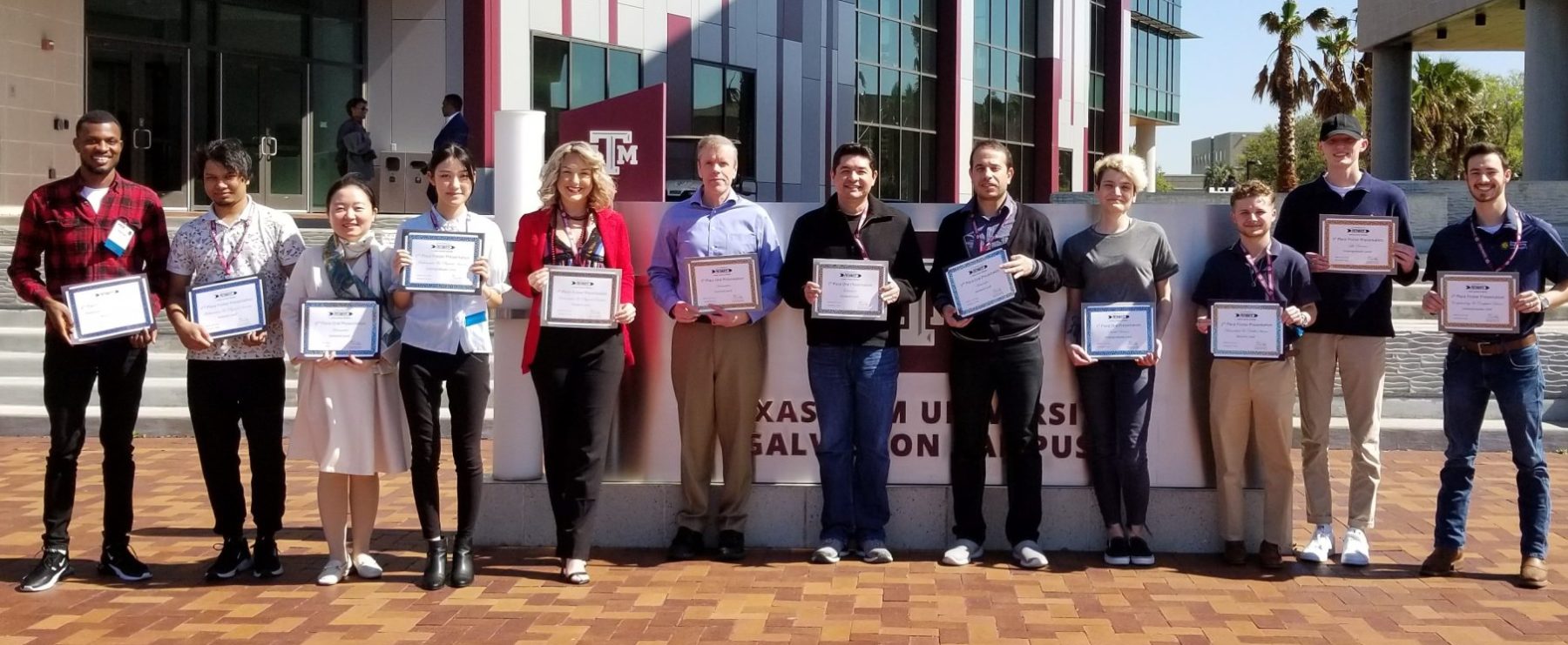 Students pose with their award certificates.