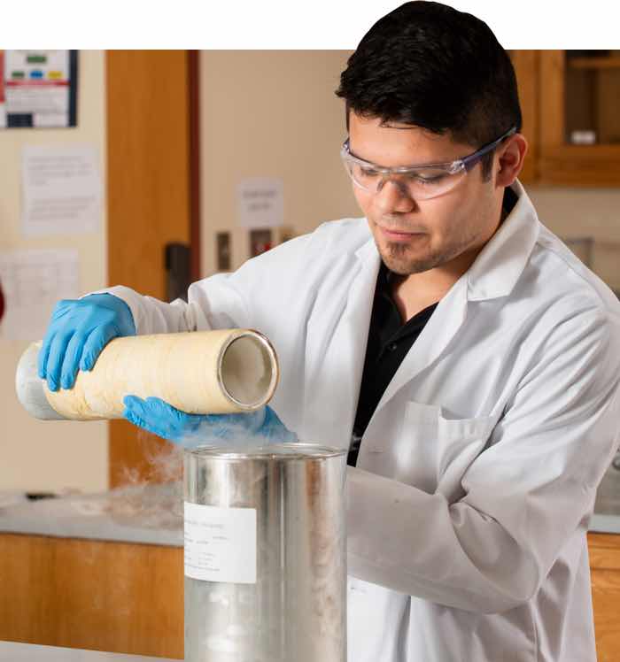 Student performing a chemistry experiment.