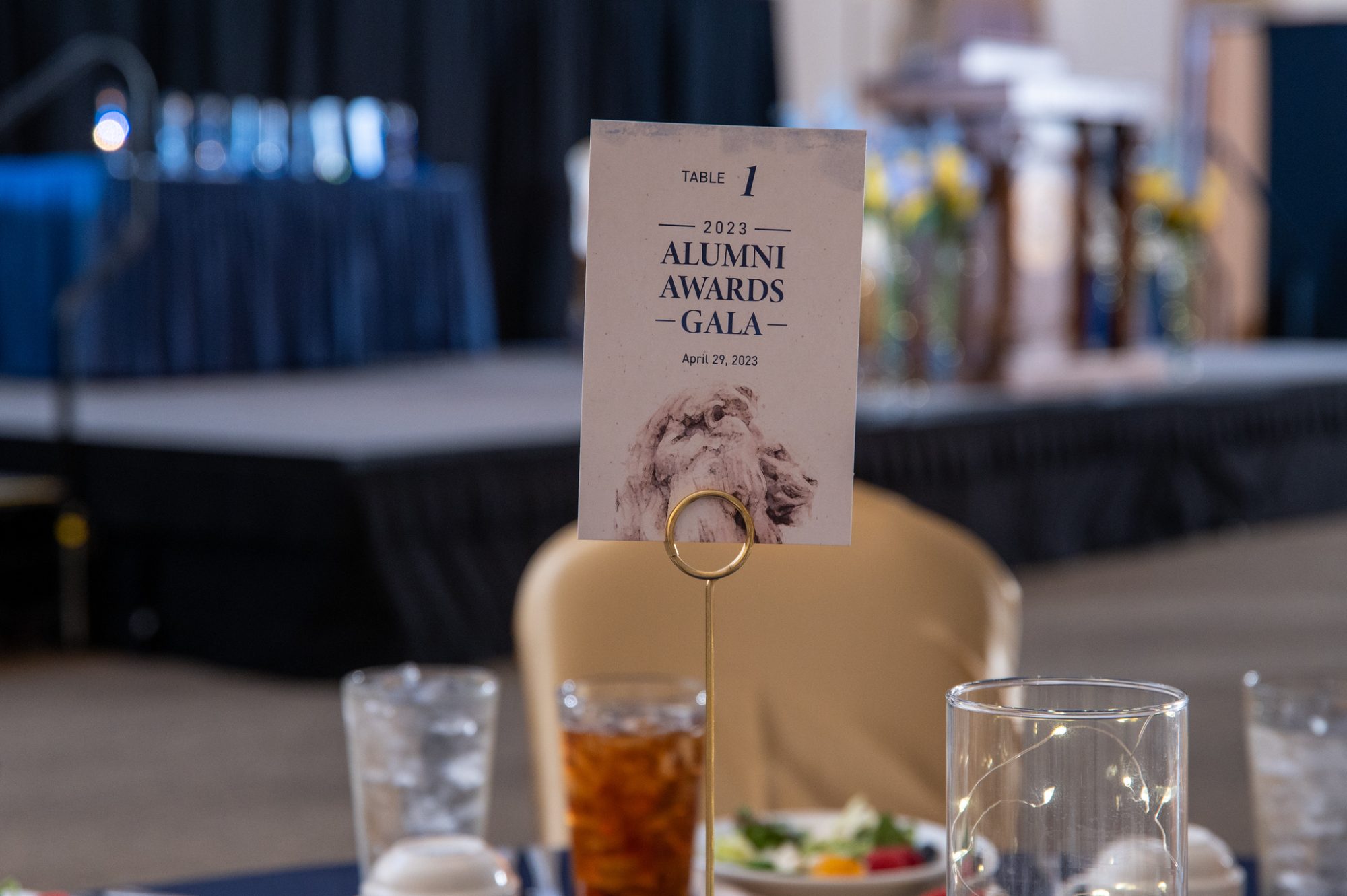 Table set for dinner with sign in middle denoting "Table 1."