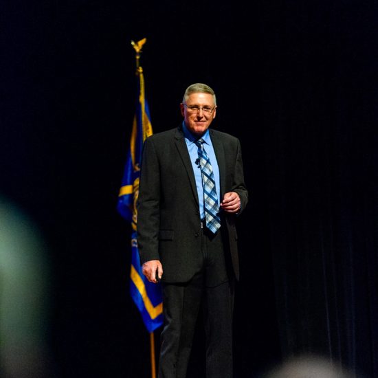 A speaker on a stage.