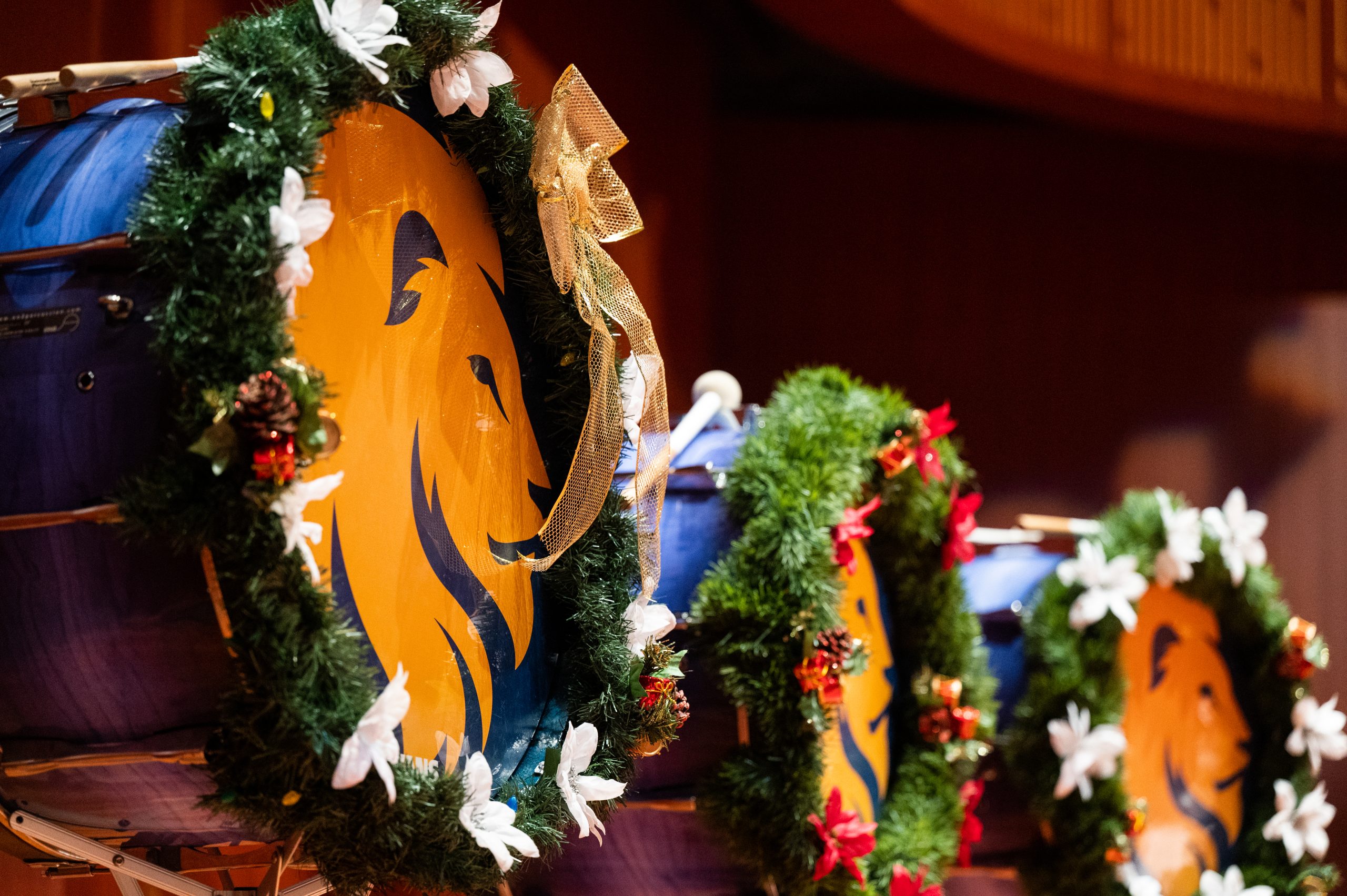 Drums decorated in christmas garland.