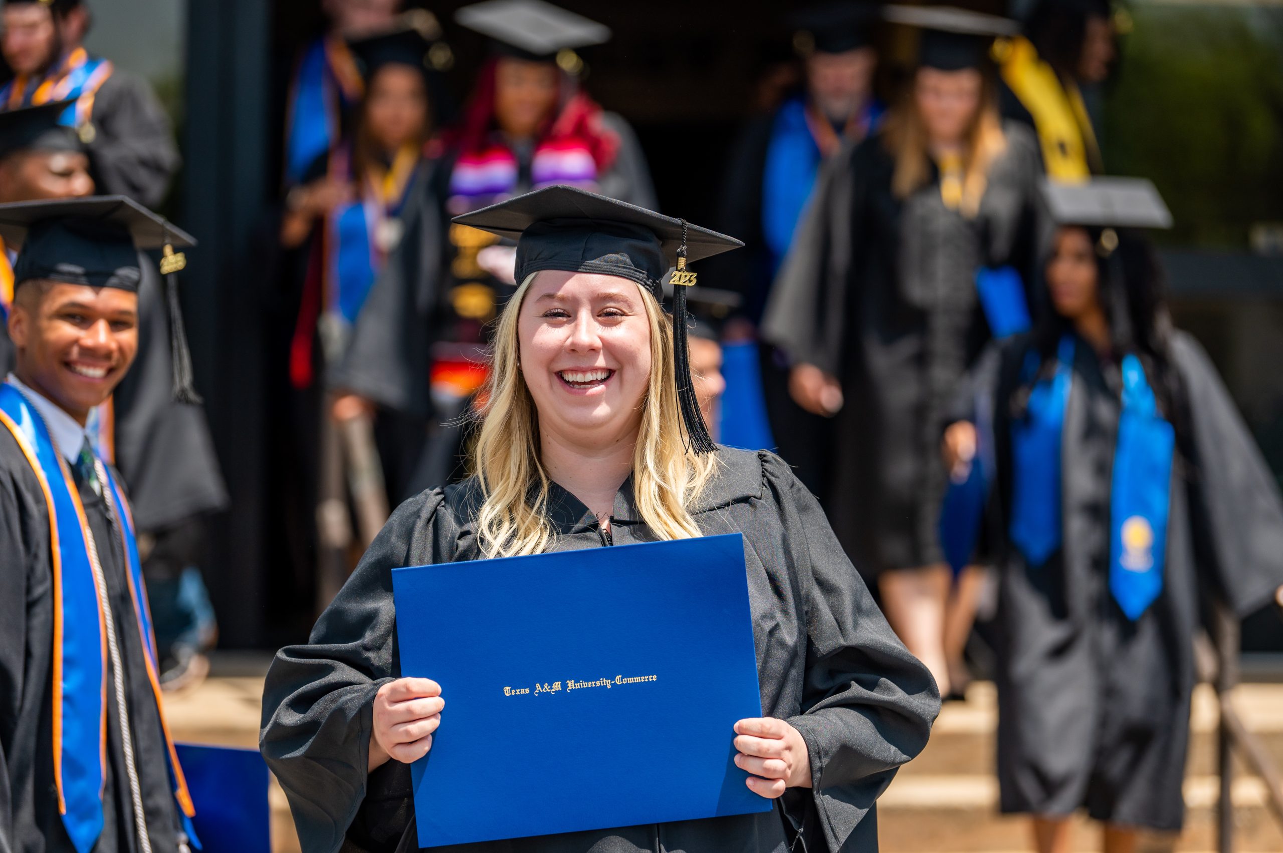 A female graduate student smiling for the picture. 