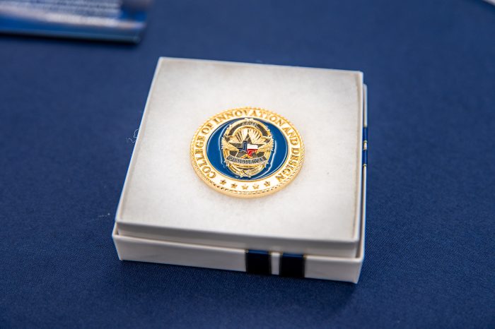 A commemorative coin inside a jewelry box.