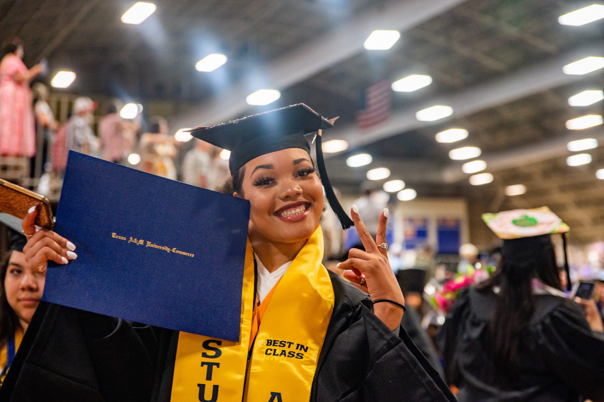 A female student smiling at the camera man.