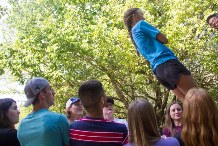 A group of students watching a challenge.