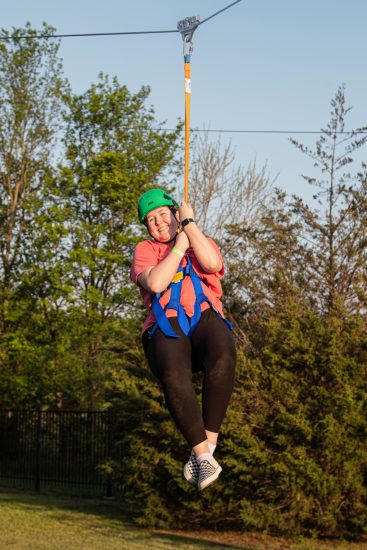 Female students ziplining.