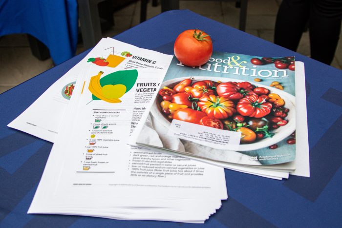 A table filled with cooking magazine and nutrition