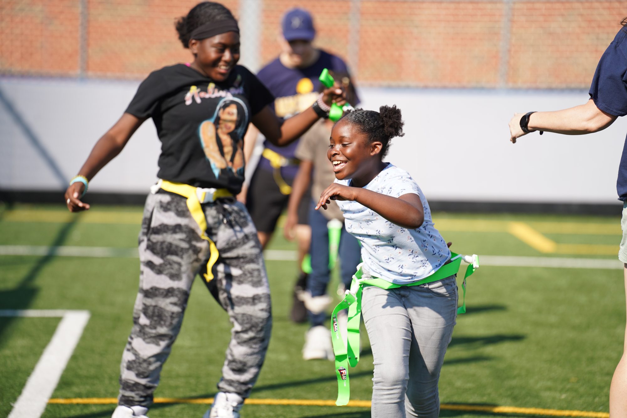 Two students enjoying a game of flag tag.