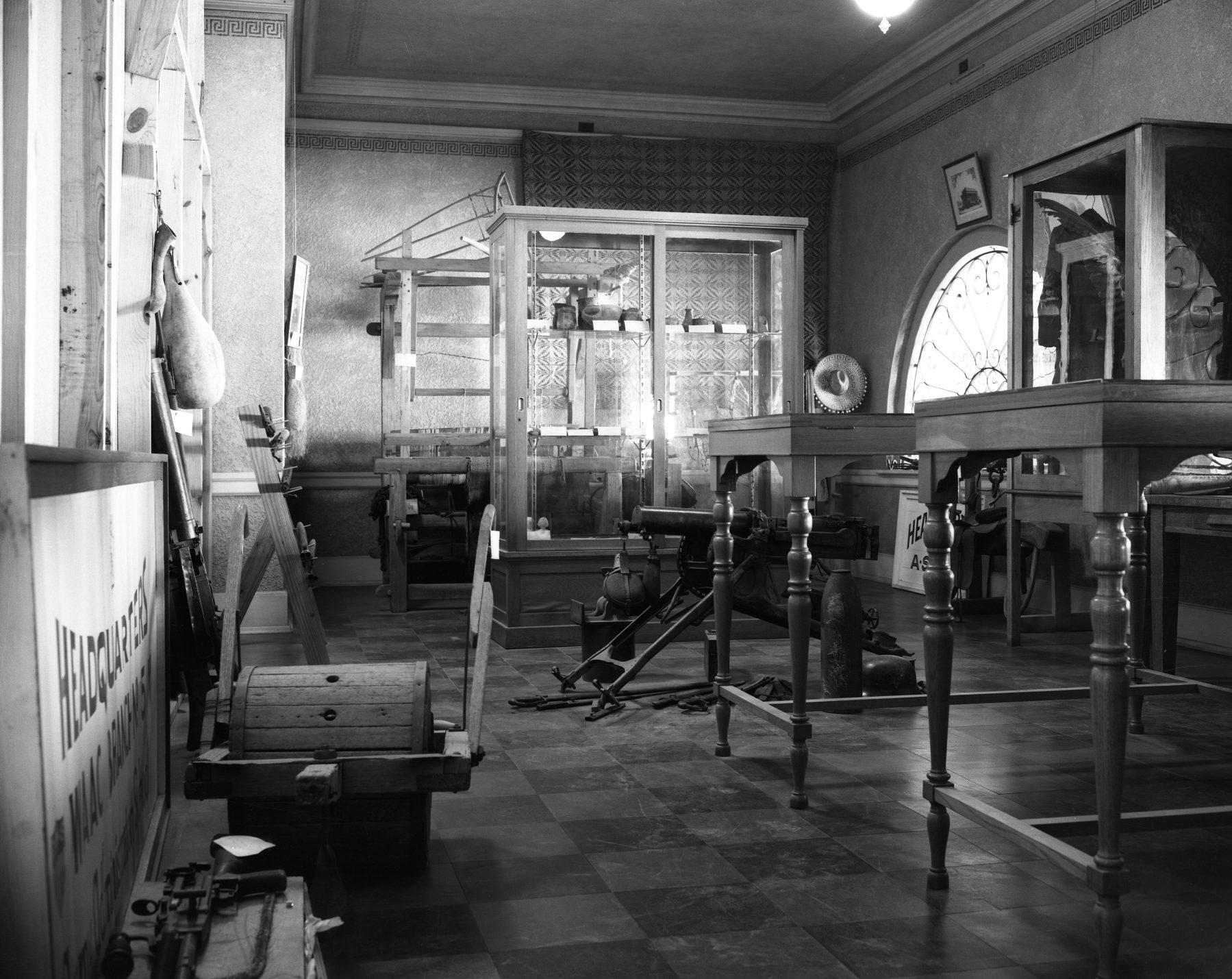 A black and white photo of items in a historic museum