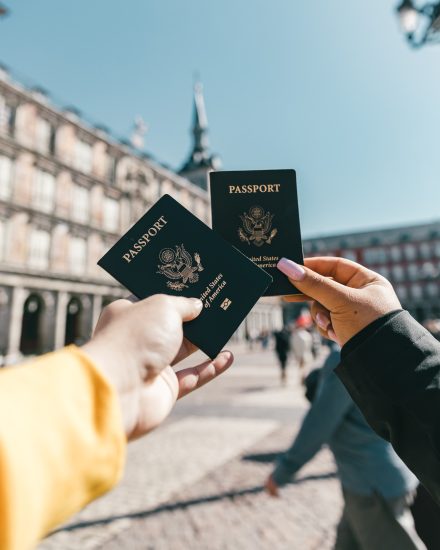 Two passports being displayed in the picture.