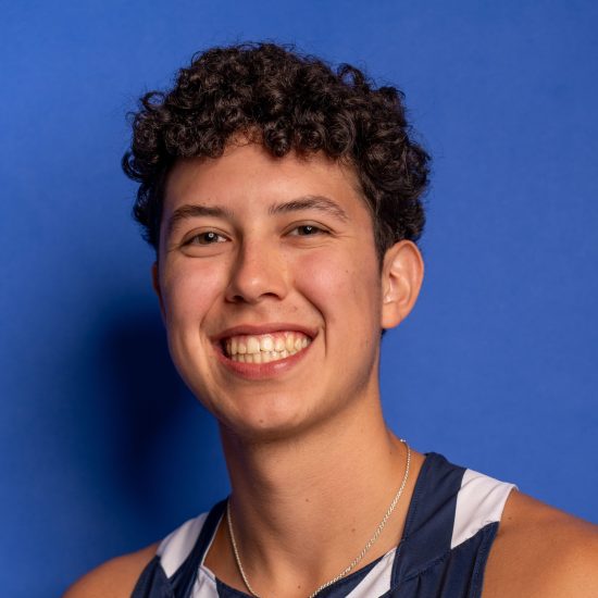 A student-athlete poses for a headshot photo.