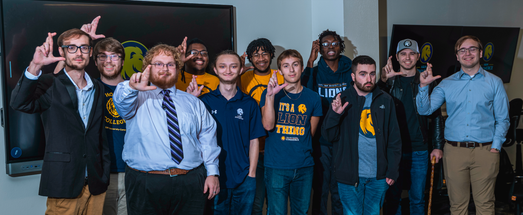 A group of people stand and pose for a photo