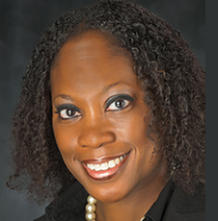 A woman poses for a professional headshot.