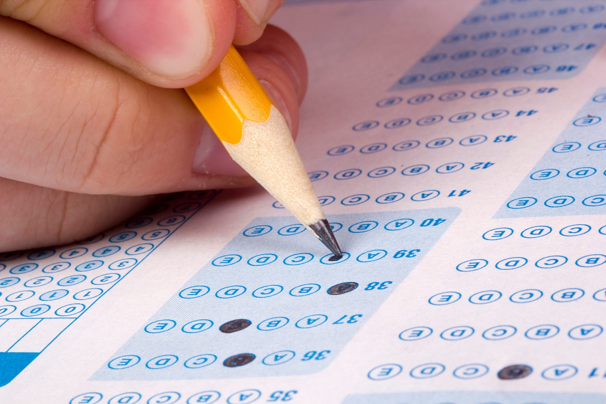 An individual using a scantron. 