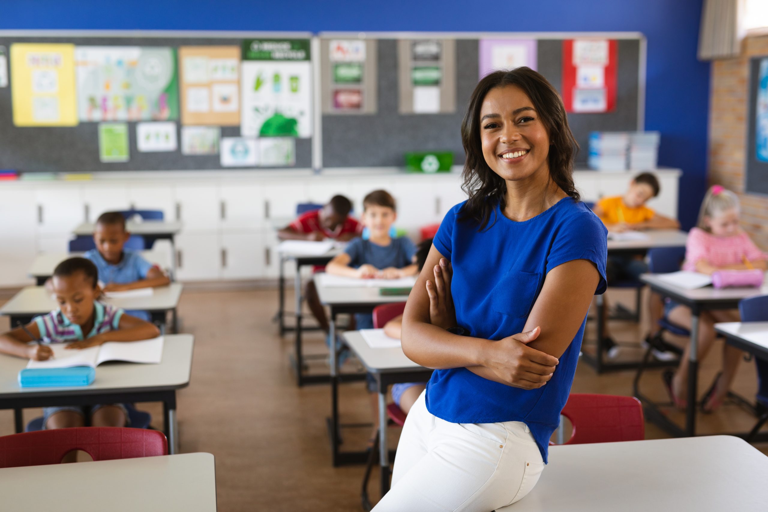 Portrait of african american female teacher smiling in the class