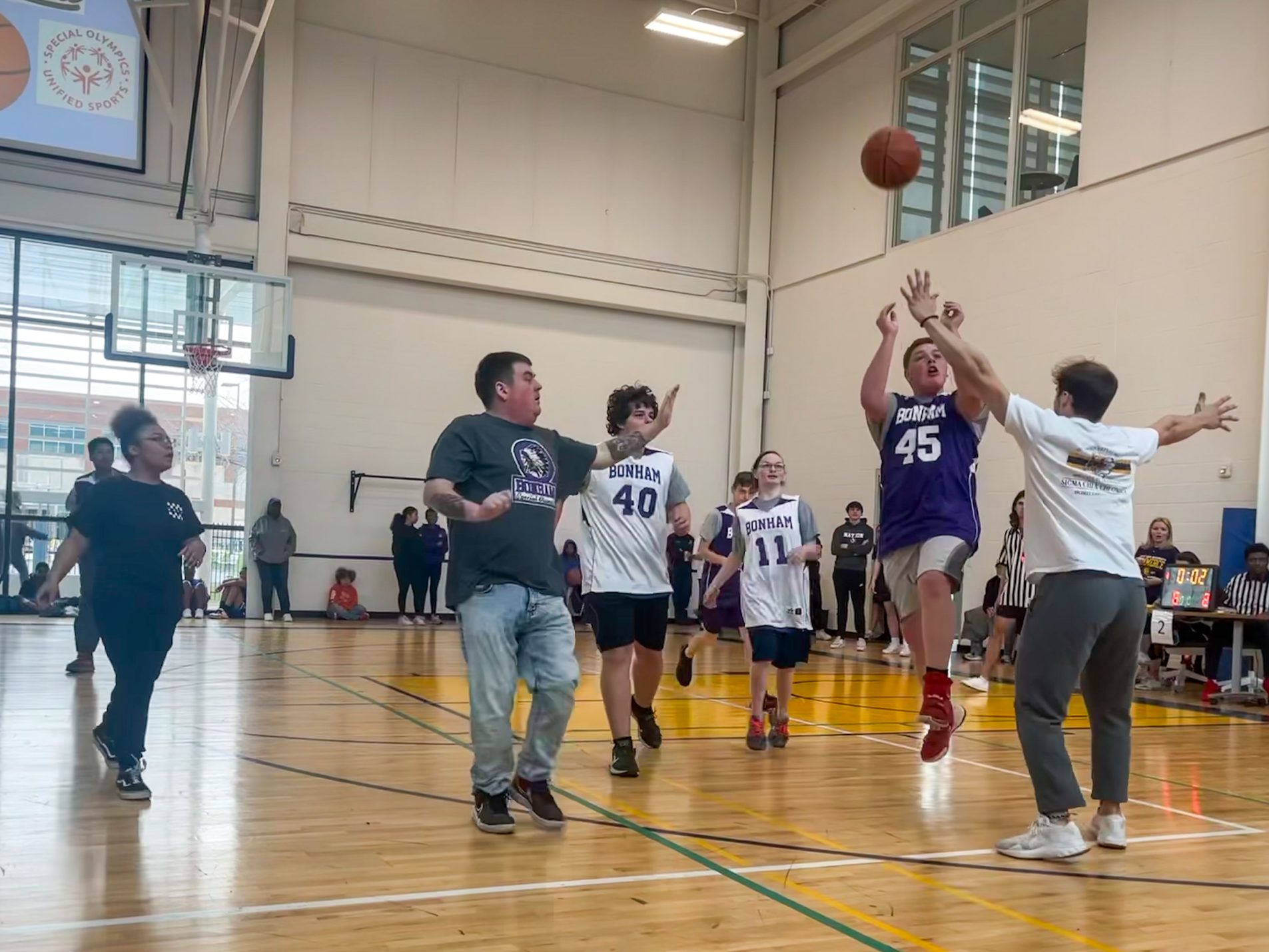 A group of students playing basketball.